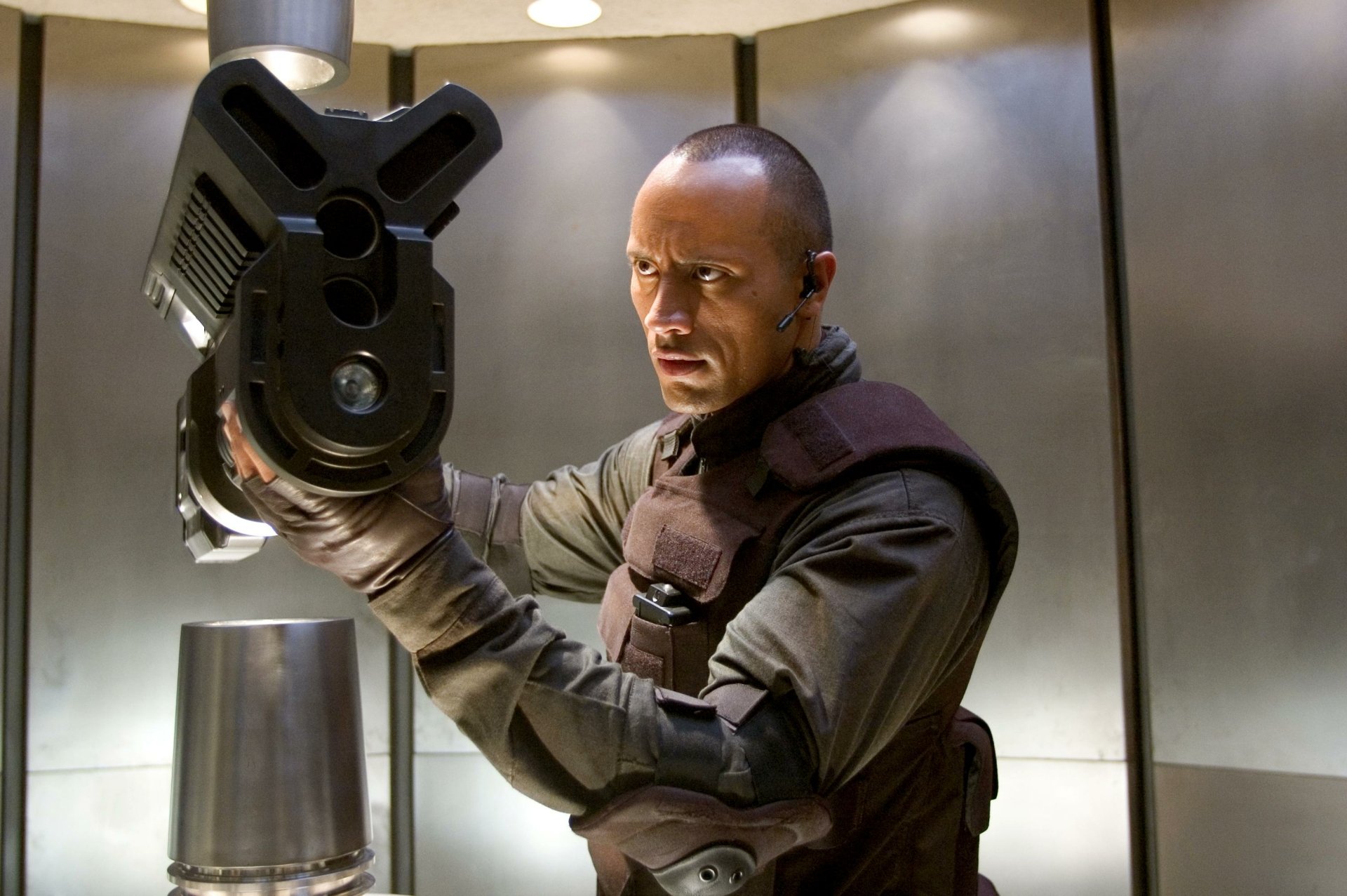 HD PC desktop wallpaper featuring a scene from the movie Doom with a character holding a large futuristic weapon in a sci-fi setting.