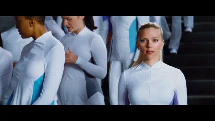HD PC desktop wallpaper — blonde woman in a white futuristic suit stands among others on steps in a scene from the movie The Island.