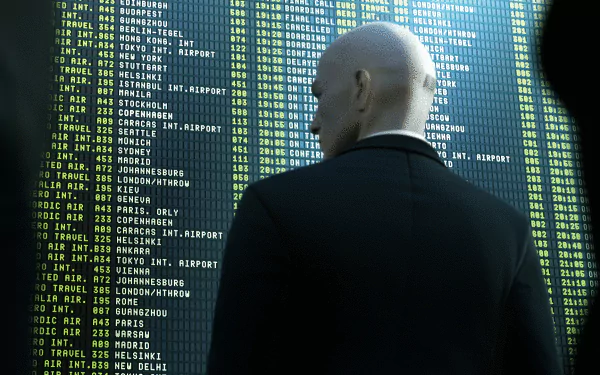HD PC desktop wallpaper featuring a scene from the video game Hitman, showing Agent 47 facing a large digital display of airport codes and flight information.