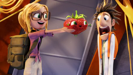 Sam Sparks joyfully presents a quirky animated strawberry to Flint Lockwood in a scene from Cloudy with a Chance of Meatballs 2, showcased as an HD desktop wallpaper.