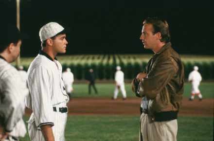 HD movie scene from Field of Dreams showing two men facing each other on a baseball field, designed as a PC desktop wallpaper and background.
