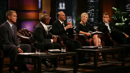 HD desktop wallpaper featuring the panel of the Shark Tank show seated and ready to judge business pitches.