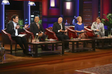 HD desktop wallpaper of the Shark Tank cast seated in the studio, engaging in discussion.