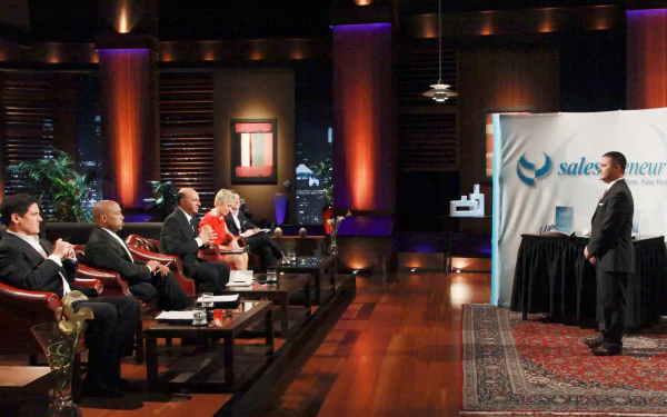 HD desktop wallpaper featuring a Shark Tank scene with investors evaluating a presenter.