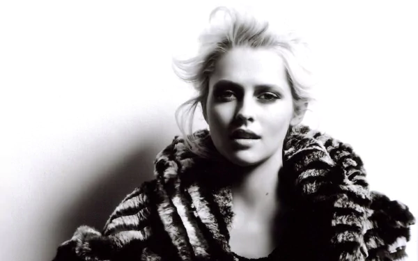Black and white HD desktop wallpaper of Australian actress and celebrity Teresa Palmer wearing a textured fur coat against a light background.