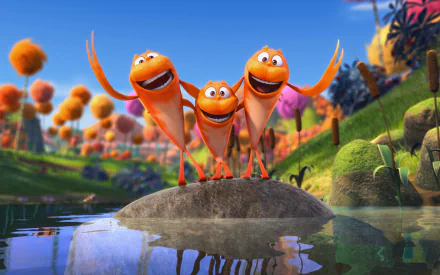 Movie The Lorax — 2K Quad HD PC desktop wallpaper and background: three grinning orange creatures on a rock in a vibrant Truffula-tree landscape, their reflections sparkling on the water.