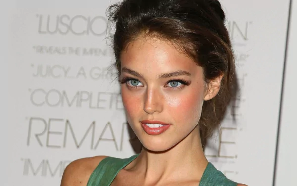 An HD desktop wallpaper featuring American model and celebrity Emily DiDonato, showcasing her striking features and captivating gaze.