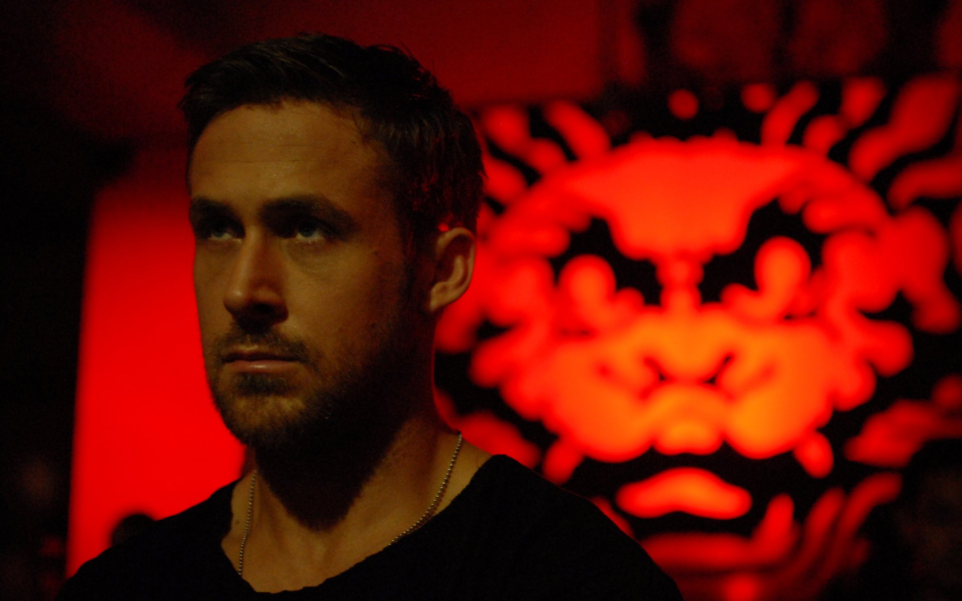 HD desktop wallpaper featuring Ryan Gosling from the movie Only God Forgives, with a striking red and black background.