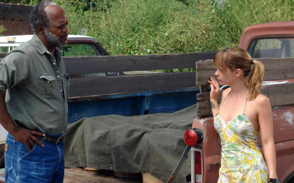 Samuel L. Jackson and Christina Ricci in a scene from the movie Black Snake Moan, featured in an HD PC desktop wallpaper and background.