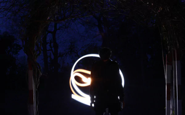 A dark, artistic 4K Ultra HD wallpaper featuring a shadowy ninja figure with an ominous glowing monster symbol in the background, evoking an evil atmosphere.