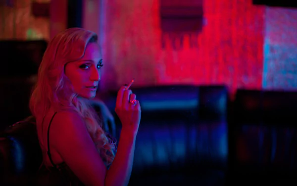 Kristin Scott Thomas in a moody, neon-lit scene from the movie Only God Forgives, featured as an HD PC desktop wallpaper and background.