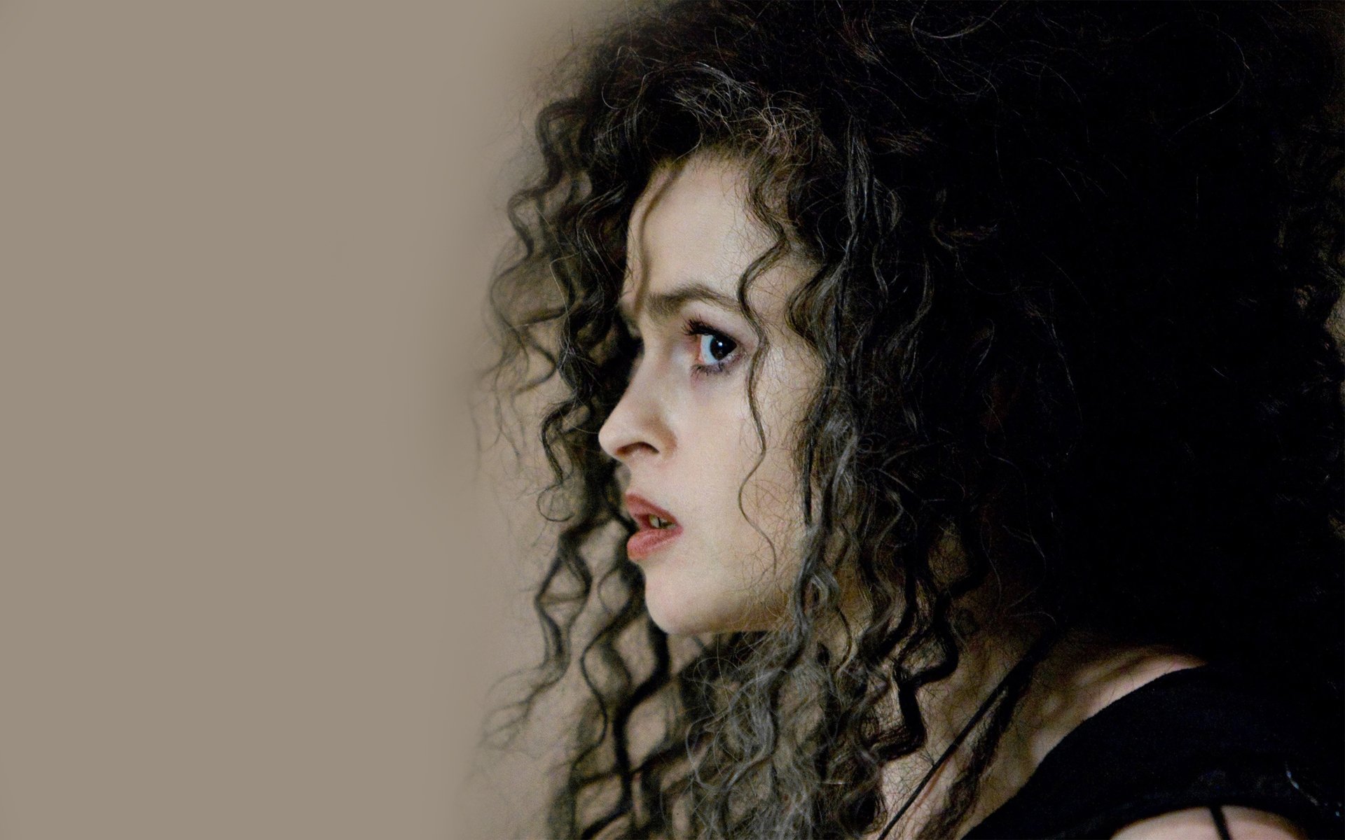 HD desktop wallpaper featuring English actress and celebrity Helena Bonham Carter in a close-up profile against a neutral background.