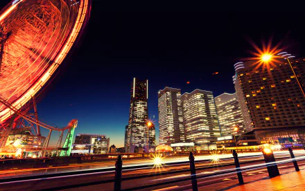 Nighttime cityscape of Yokohama, Japan, featuring illuminated buildings and a Ferris wheel, designed as an HD desktop wallpaper.