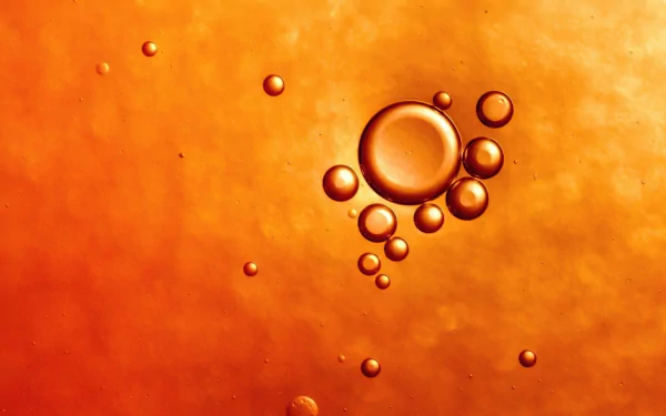 Abstract wallpaper featuring bubbles on a vibrant orange background. This HD image adds a unique artistic touch to any desktop or digital space.