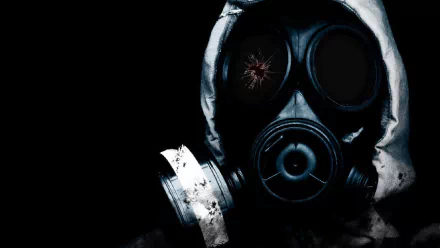 A dark, atmospheric HD wallpaper featuring a masked figure in a gas mask, evoking themes of anarchy and intensity, with hints of blood and shadowy elements.
