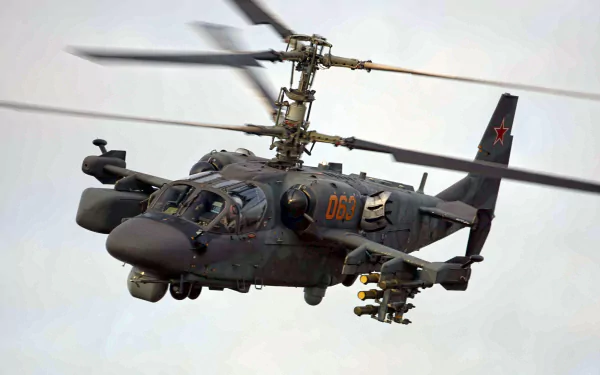 Military Kamov Ka-52 attack helicopter in flight, armed and highly detailed — HD PC desktop wallpaper background.