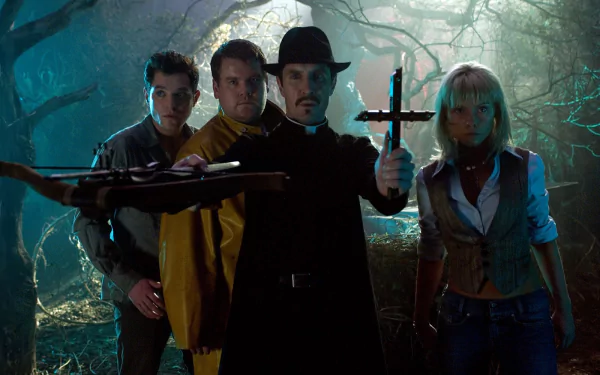 HD PC wallpaper: movie scene Lesbian Vampire Killers — four armed figures in a misty forest, one holding a cross, creating a tense, gothic-horror atmosphere.
