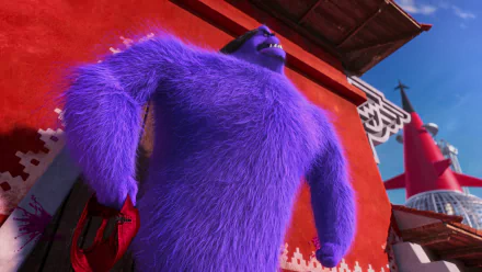 HD PC desktop wallpaper featuring Eduardo El Macho, the purple furry villain from the movie Despicable Me 2, standing confidently against a red background.