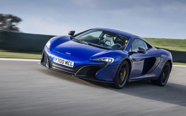 Blue McLaren 650S supercar vehicle speeding on a track, sleek low-slung sports car in motion — HD PC desktop wallpaper