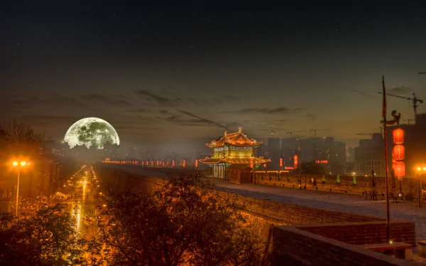 A stunning HD scenic wallpaper capturing a night view of a historic building illuminated by streetlights, with a large full moon casting a serene glow over the landscape.