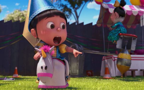 Agnes from Despicable Me 2 joyfully points while riding a unicorn toy, wearing a party hat in a festive outdoor setting, captured in vibrant HD for a lively desktop wallpaper.