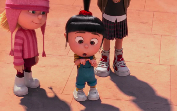 Agnes and Edith from Despicable Me 2 are featured in this colorful HD wallpaper, capturing a playful moment as they enjoy an adventure together.