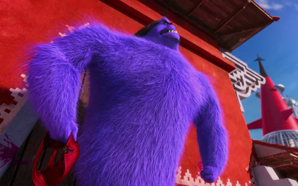 HD PC desktop wallpaper featuring Eduardo El Macho, the purple furry villain from the movie Despicable Me 2, standing confidently against a red background.