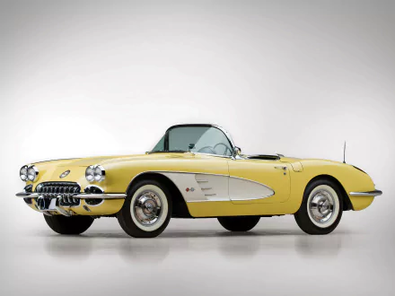 HD PC desktop wallpaper featuring a classic yellow Chevrolet Corvette (C1) vehicle against a plain white background.