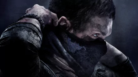 A character from Call of Duty: Ghosts prepares for battle, partially obscured by a mask, showcasing a gritty atmosphere in this HD desktop wallpaper.