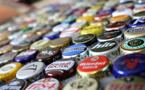 HD PC desktop wallpaper: close-up, shallow-focus array of colorful beer bottle caps scattered across a surface (Misc, Beer Bottle Caps).