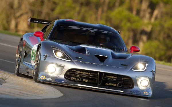 HD PC desktop wallpaper featuring a sleek Dodge Viper GTS-R racing vehicle on a curving track, showcasing its aggressive design and aerodynamic body.