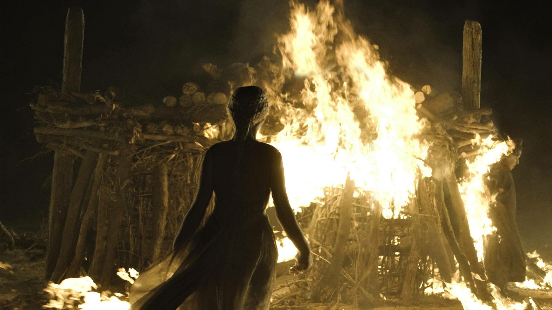 Daenerys Targaryen silhouette from the TV show Game of Thrones approaching a blazing funeral pyre — HD PC desktop wallpaper.