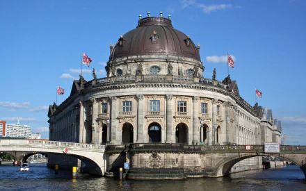 HD PC desktop wallpaper & background: man-made Bode Museum on Berlin's Museum Island, domed riverside façade and bridge beneath a clear blue sky.