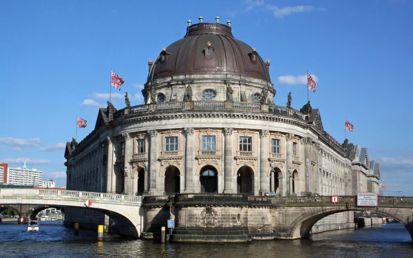 HD PC desktop wallpaper & background: man-made Bode Museum on Berlin's Museum Island, domed riverside façade and bridge beneath a clear blue sky.
