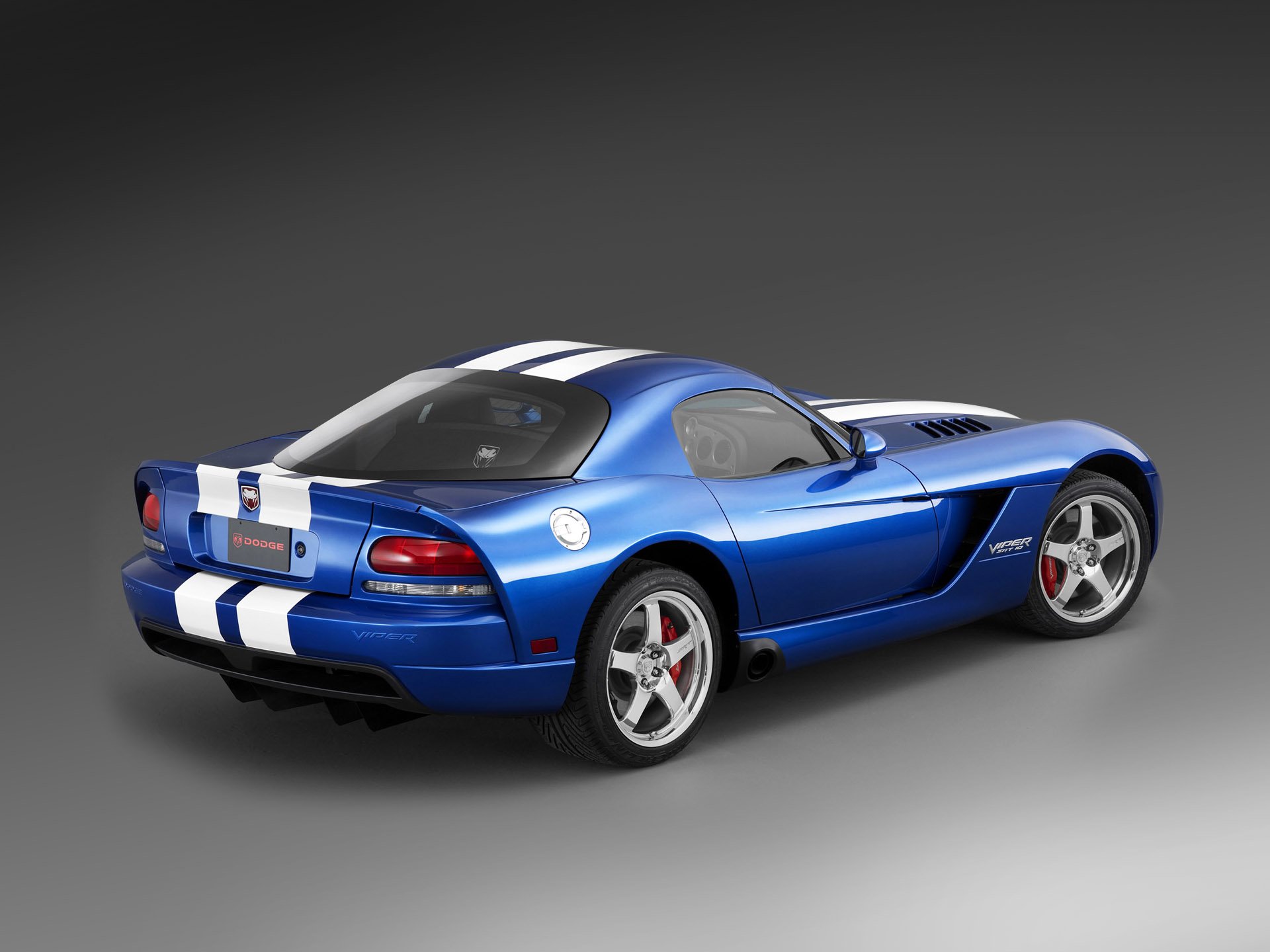 HD PC desktop wallpaper background: blue Dodge Viper SRT-10 sports vehicle with white racing stripes, rear three-quarter view on a neutral gray backdrop.