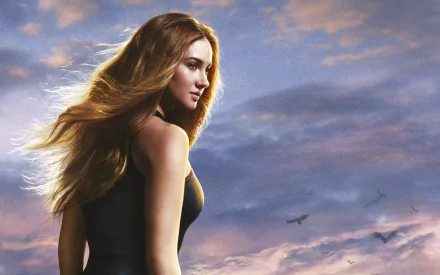 A striking HD desktop wallpaper featuring Shailene Woodley, highlighted against a dramatic sky with flowing hair, embodying strength and beauty.