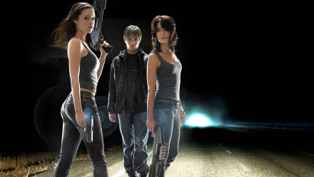 HD desktop wallpaper featuring main characters from the TV show Terminator: The Sarah Connor Chronicles, standing with weapons against a dark, dramatic background.