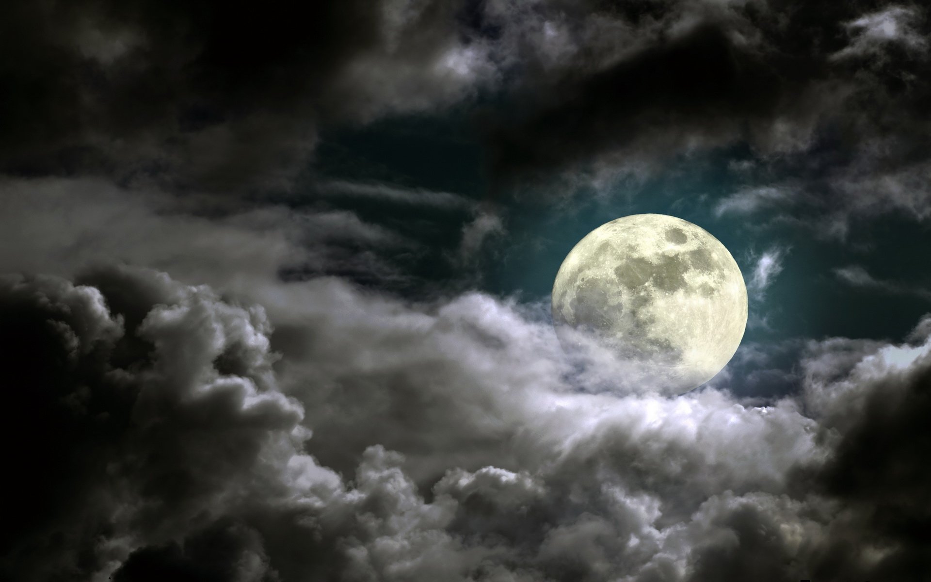A stunning HD wallpaper depicting a bright full moon surrounded by swirling clouds, capturing the beauty of nature at night.