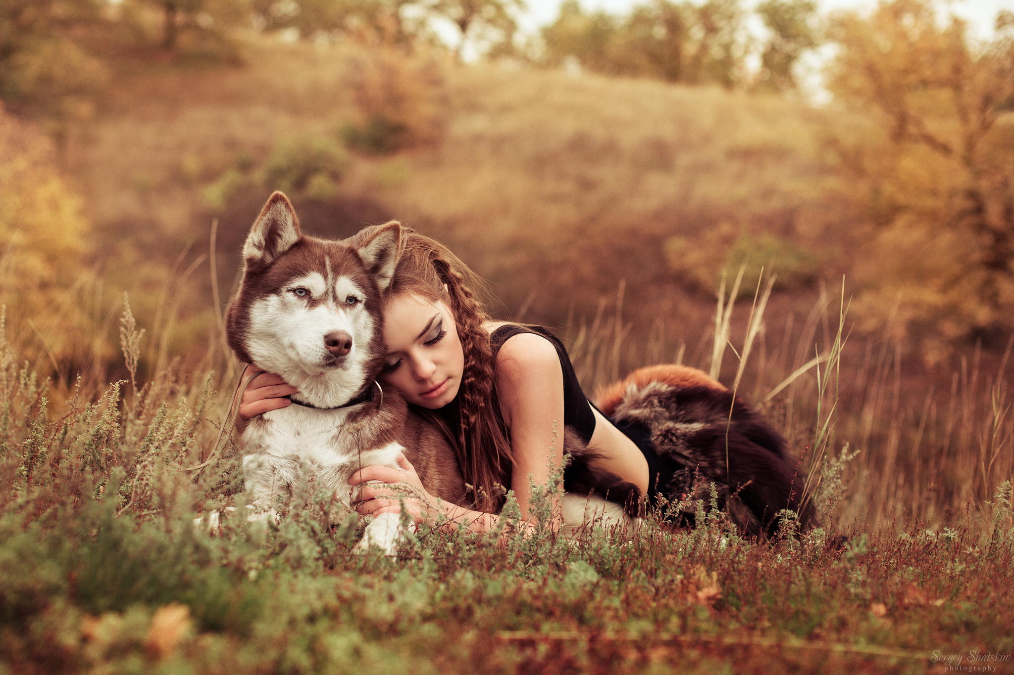 Model enjoying a break with her husky dog. by Sergey Shatskov