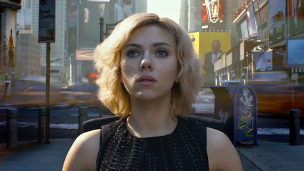 A striking HD wallpaper featuring Scarlett Johansson as Lucy, standing confidently in a bustling urban scene, capturing the film's dynamic energy.