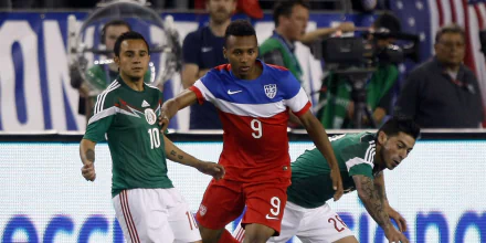 Soccer players in action on the field, HD desktop wallpaper showing USA versus Mexico match.