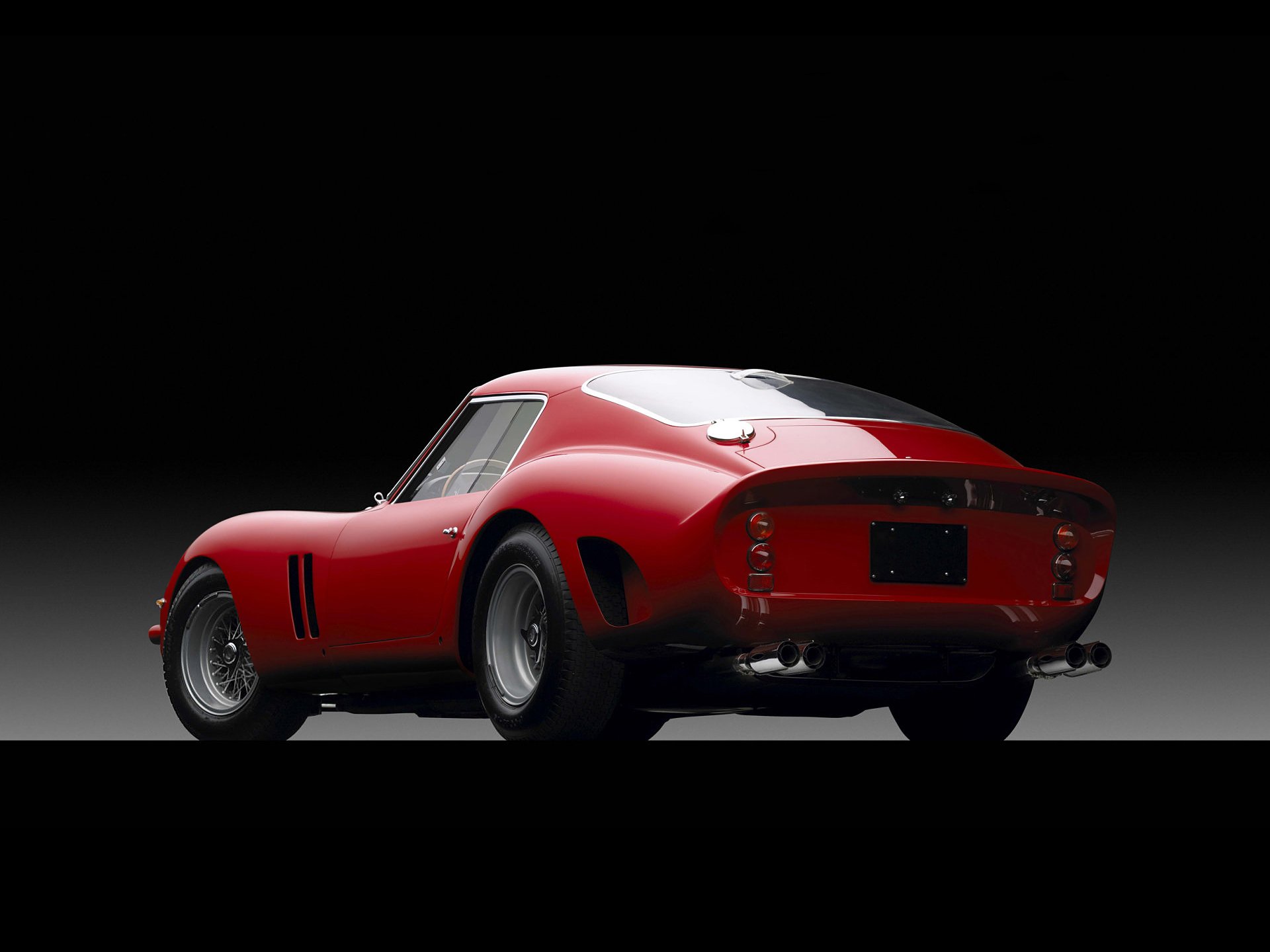 Red Ferrari 250 GTO, rear three-quarter view on a dark gradient — HD PC desktop wallpaper and vehicle background.