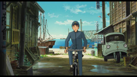 HD desktop wallpaper from From Up On Poppy Hill featuring a character riding a bicycle with a scenic old town and coastline backdrop.