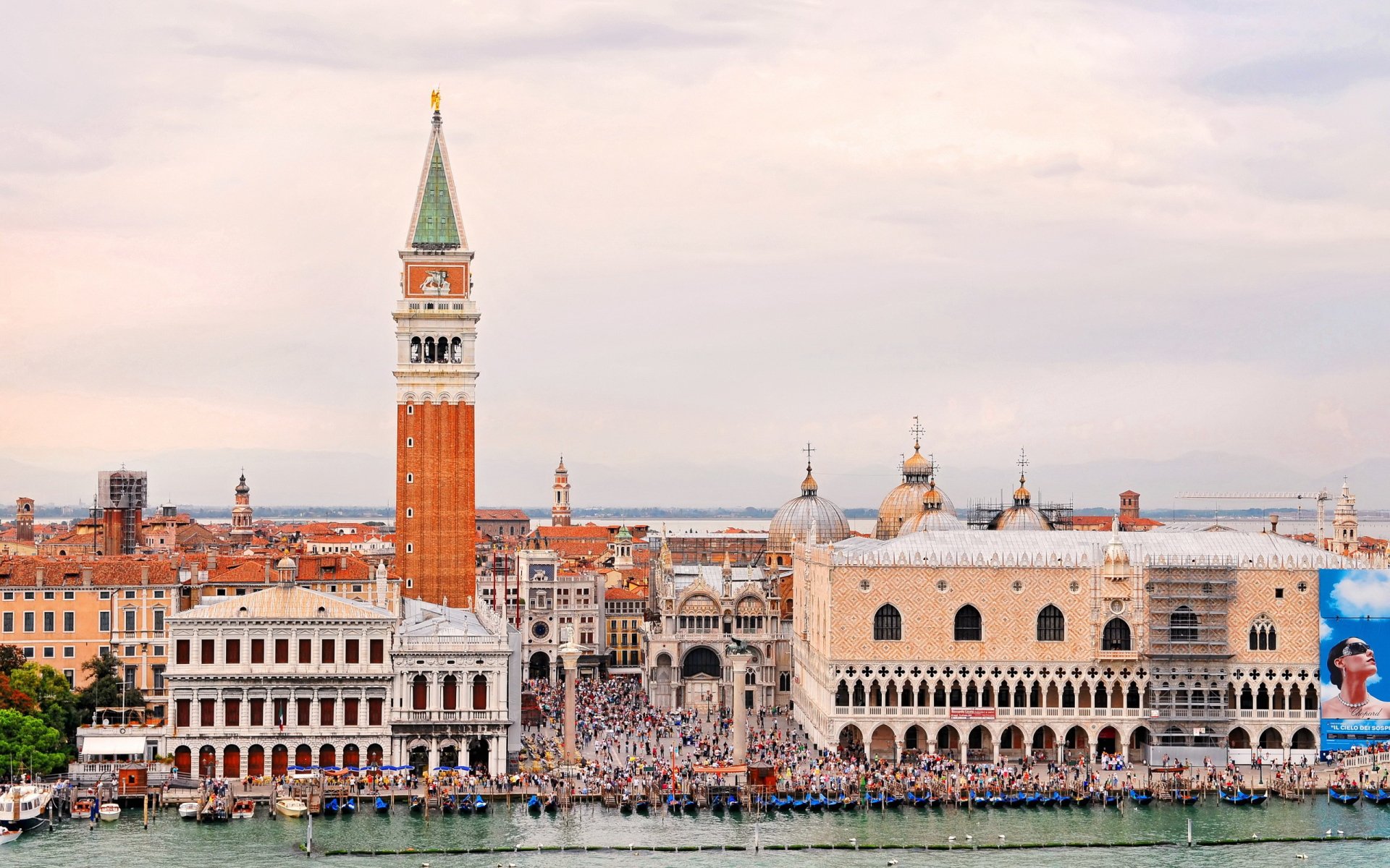 HD desktop wallpaper showcasing the iconic man-made architecture of Venice, featuring St. Mark's Campanile and surrounding historic buildings along the waterfront.