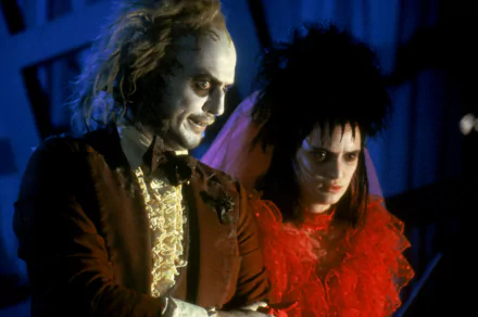 HD PC desktop wallpaper featuring characters from the movie Beetlejuice in dark, eerie lighting.