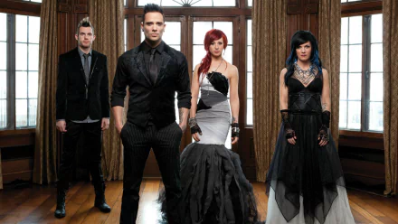 A striking HD wallpaper featuring the band Skillet, showcasing their iconic style with members dressed in stylish black attire against a backdrop of large windows.