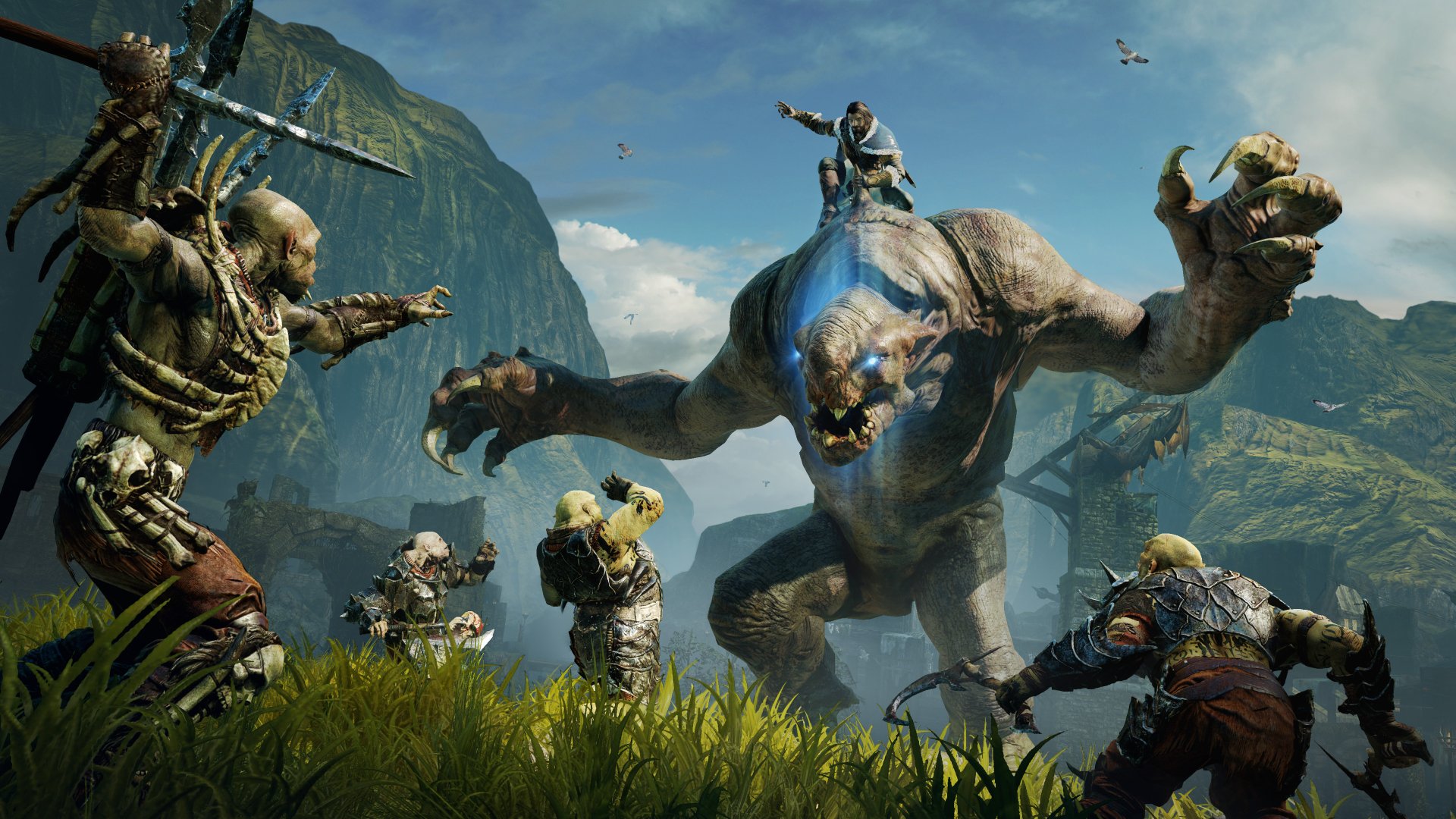 4K Ultra HD PC desktop wallpaper/background from the video game Middle-earth: Shadow of Mordor: a ranger and orc allies clash with a towering troll in a misty, mountainous valley.