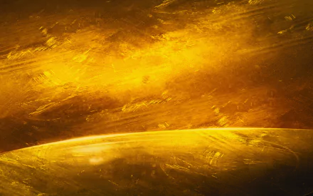 Abstract grunge HD desktop wallpaper featuring textured golden-yellow tones with dynamic brush strokes and a curved horizon-like form.