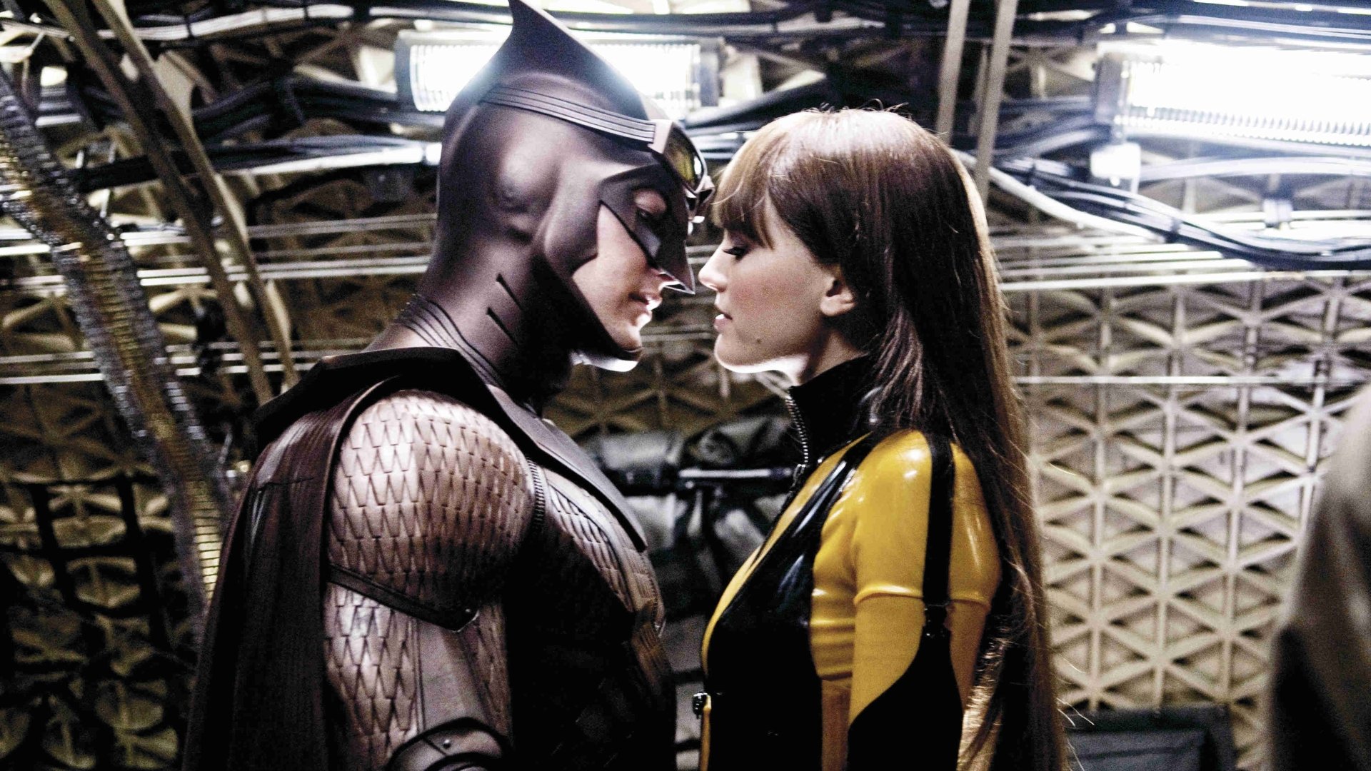 4K Ultra HD PC desktop wallpaper background from the movie Watchmen: two costumed heroes stand face-to-face in a dim, industrial hangar.