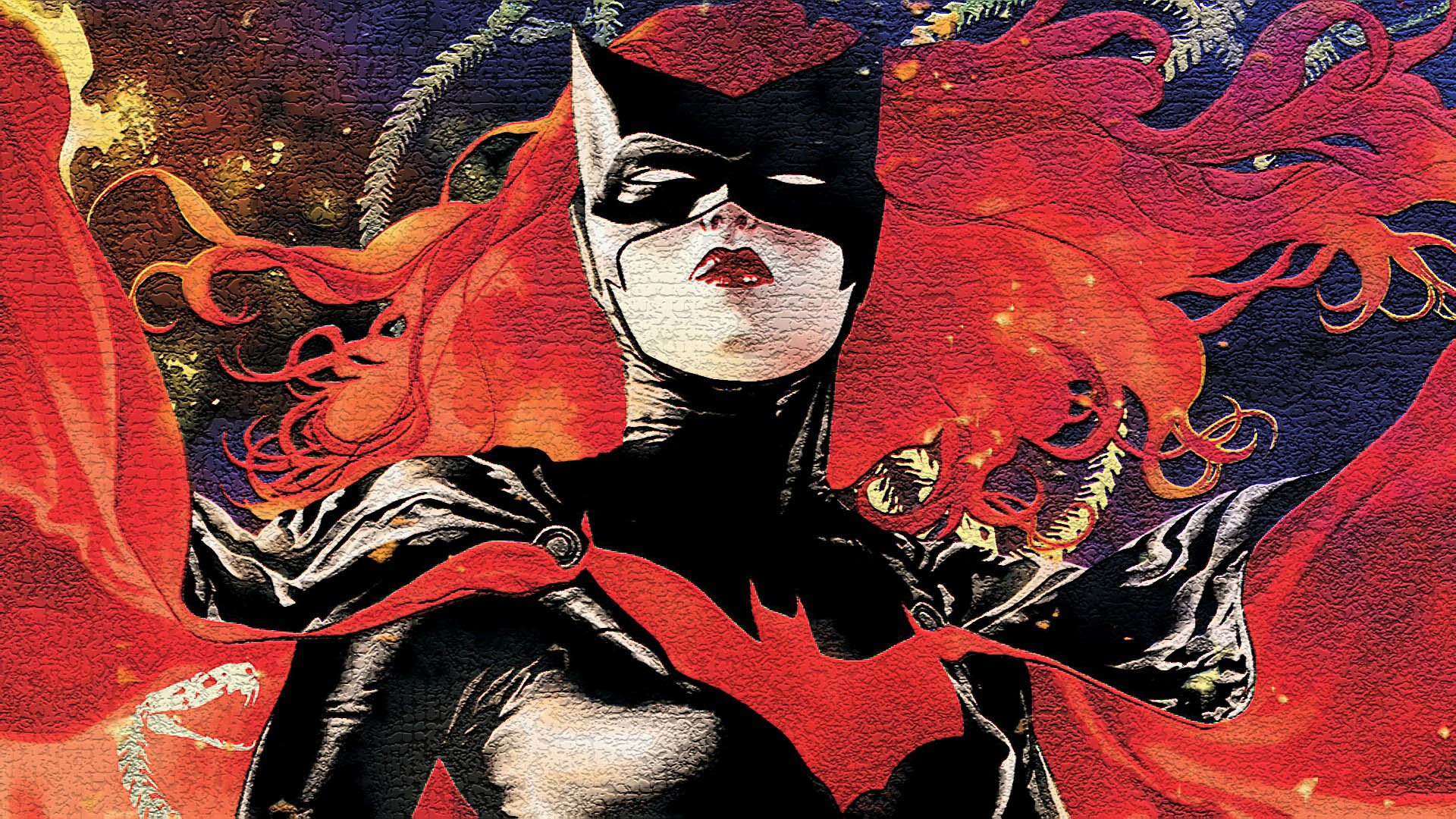 Comic Batwoman with flowing red hair and bat emblem, striking pose against a textured cosmic backdrop — HD PC desktop wallpaper and background.